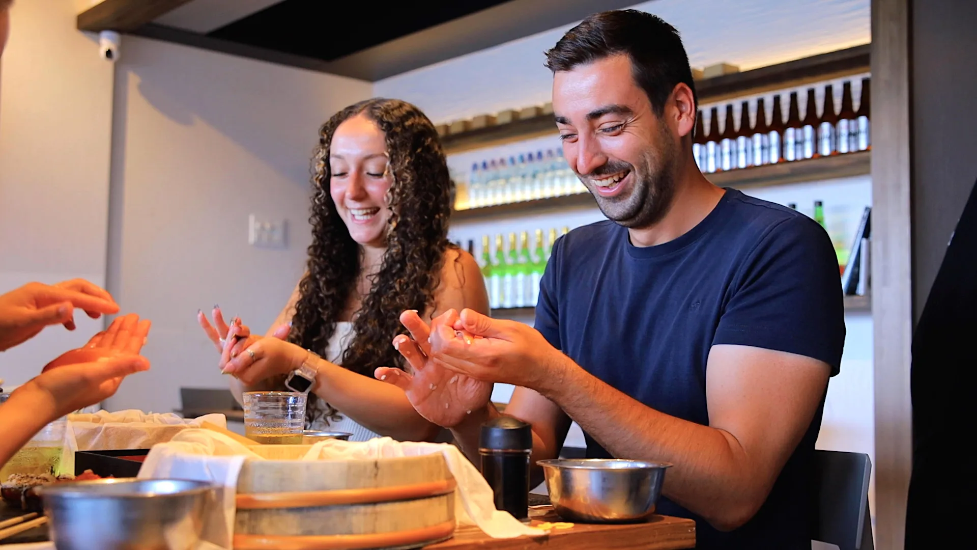 Professional sushi chef guiding students